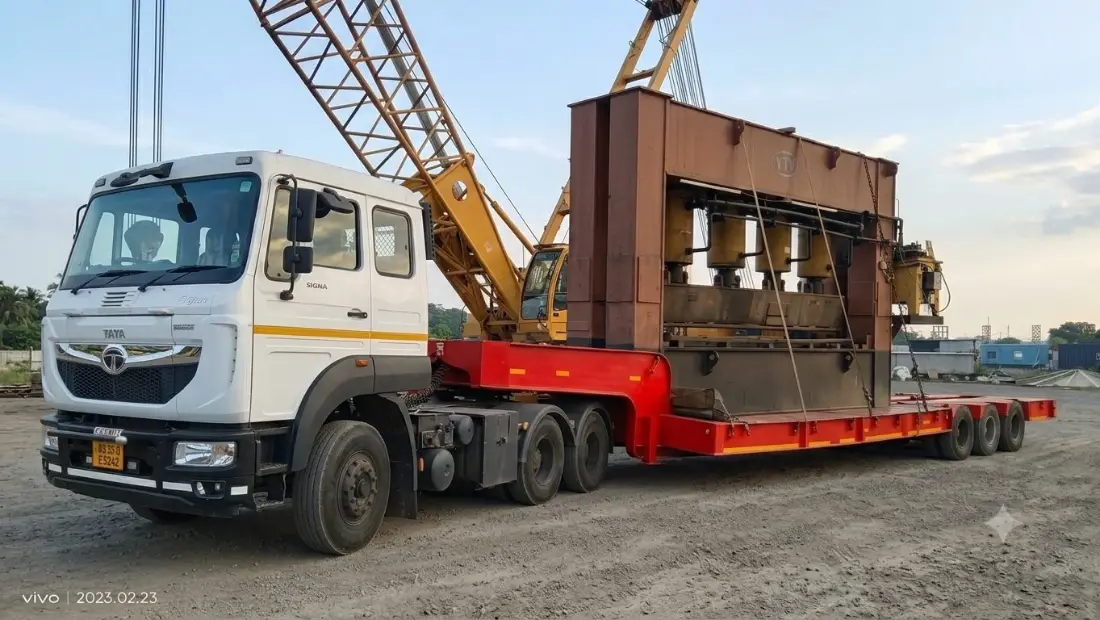 Heavy press machinery secured on a multi-axle trailer